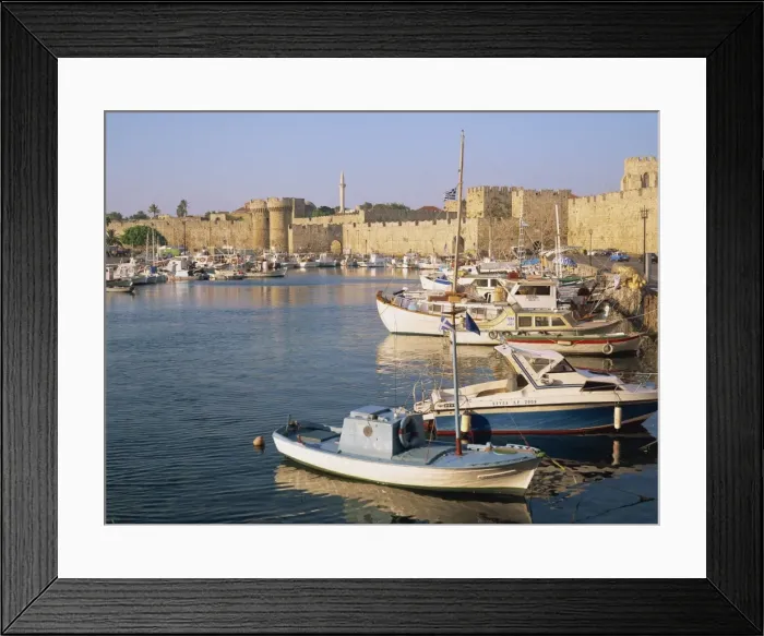 Framed Print : Moored fishing boats and the harbourside fortifications Framed Print : Moored fishing boats and the harbourside fortifications