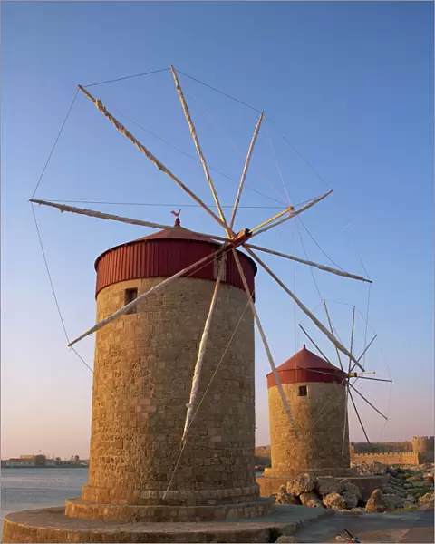 Traditional old stone windmills in dusk light