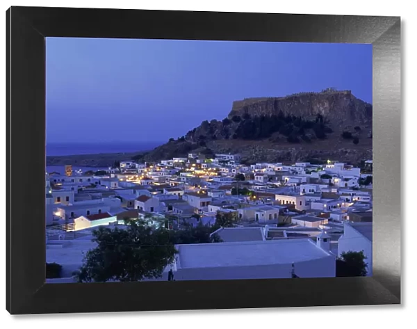 Aerial view over the town and acropolis of Lindos Town at dusk