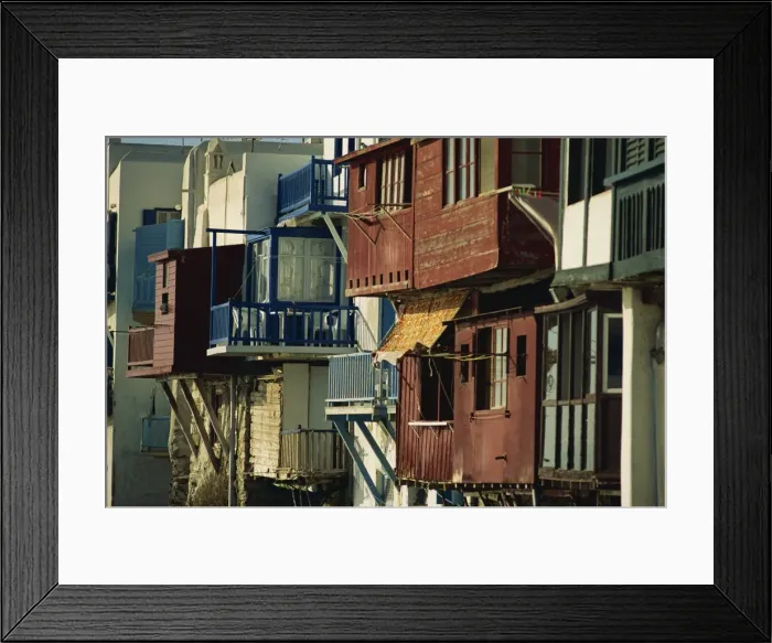 Framed Print : Close-up of exteriors of painted wooden balconies in Framed Print : Close-up of exteriors of painted wooden balconies in