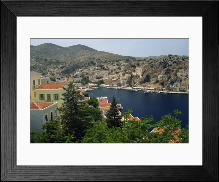 Framed Print : Aerial view over the harbour and town of Yialos on the coast Framed Print : Aerial view over the harbour and town of Yialos on the coast