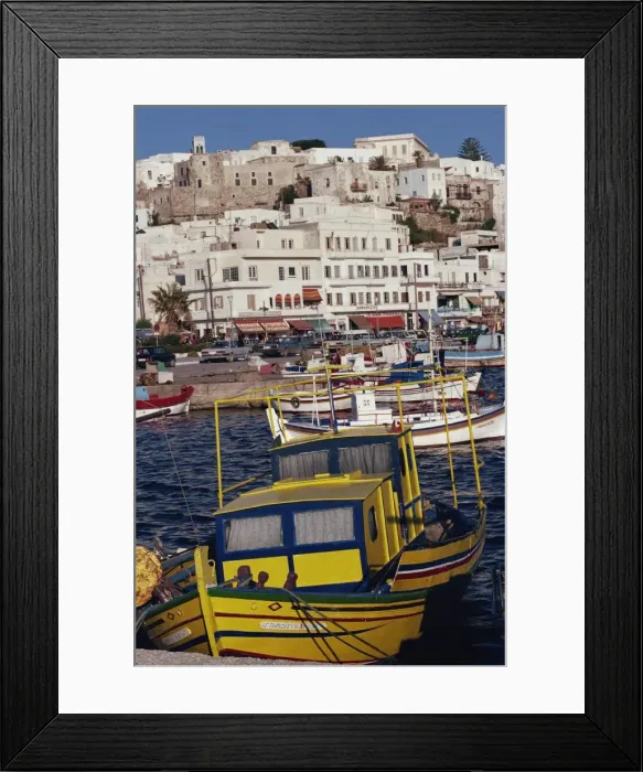 Framed Print : Fishing boats in the harbour with town in the background Framed Print : Fishing boats in the harbour with town in the background