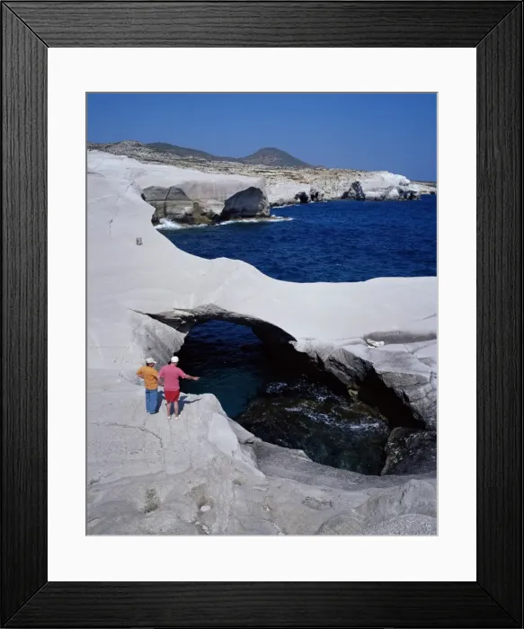 Framed Print : Tourists looking at Sarakiniko volcanic rock formations Framed Print : Tourists looking at Sarakiniko volcanic rock formations