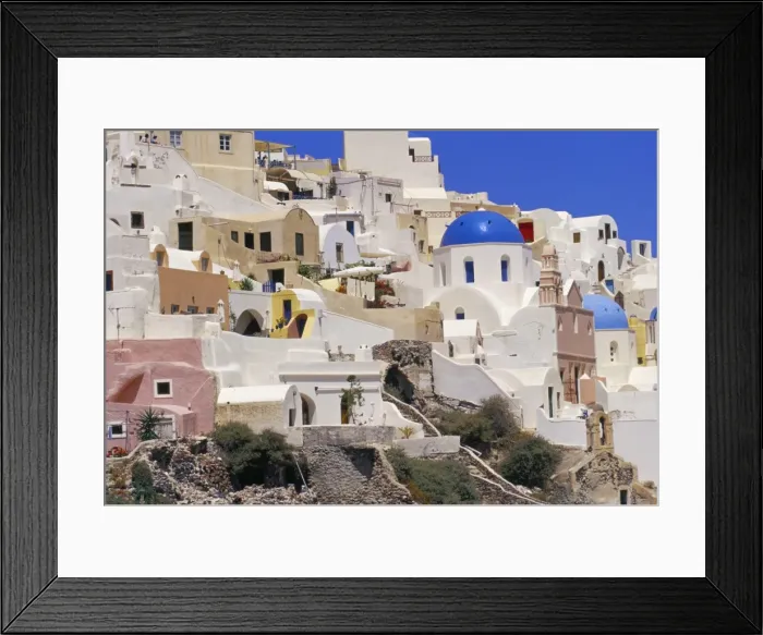 Framed Print : Village of Oia with blue churches and colourful dwellings Framed Print : Village of Oia with blue churches and colourful dwellings