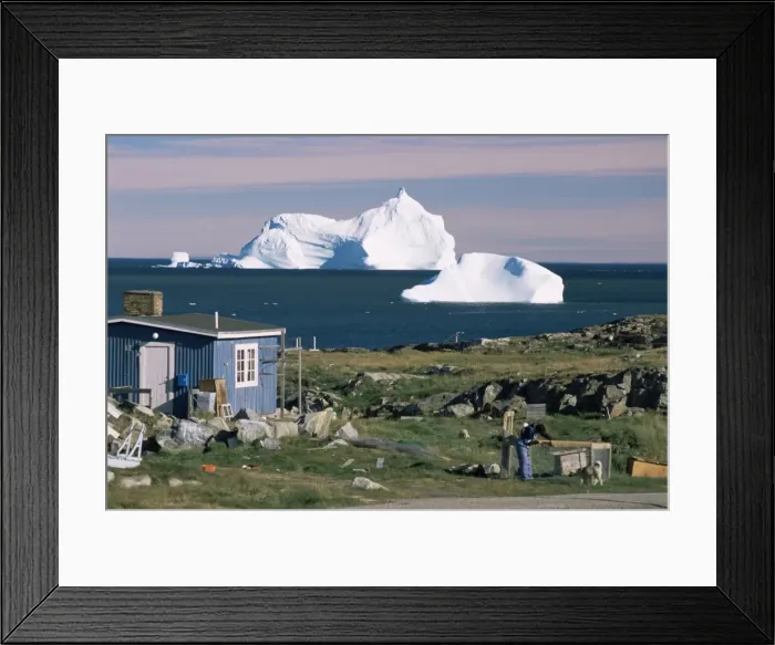 Framed Print : Painted wooden fishermans house in front of icebergs in Disko Bay Framed Print : Painted wooden fishermans house in front of icebergs in Disko Bay