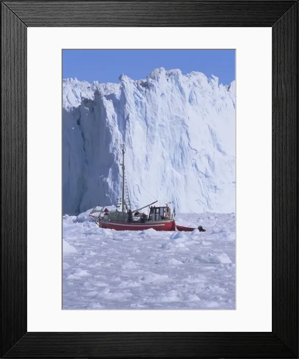 Framed Print : Red wooden boat crossing the ice in front of the Eqi Glacier Framed Print : Red wooden boat crossing the ice in front of the Eqi Glacier