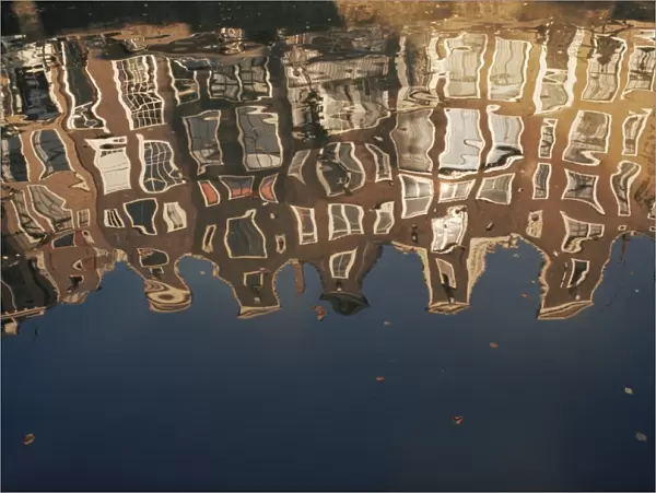Reflection of buildings in water of a canal