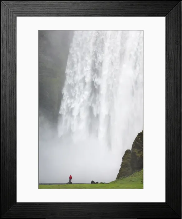 Framed Print : Tourist in red jacket at Skogafoss waterfall