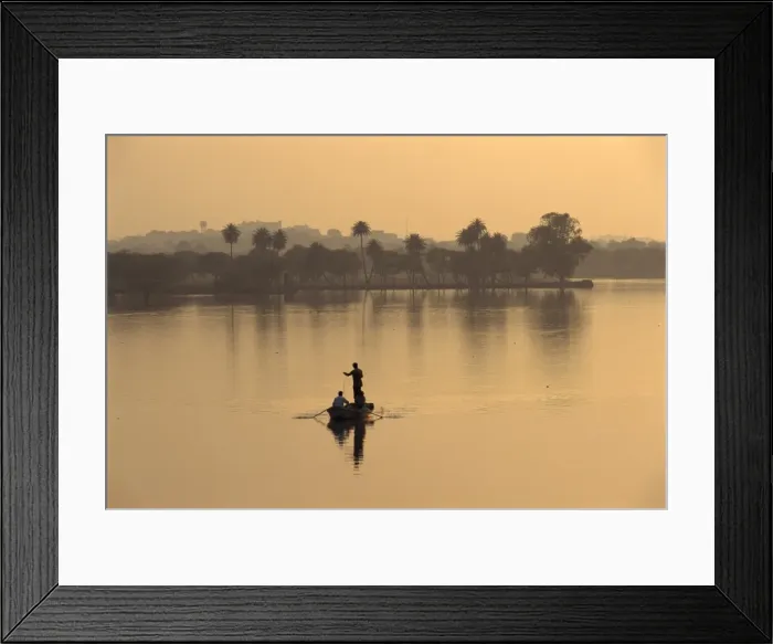 Framed Print : Men fishing in lake created by dam Framed Print : Men fishing in lake created by dam