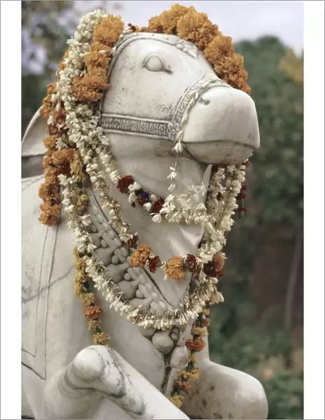 Sacred bull statue and garlands