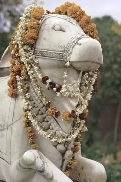 Sacred bull statue and garlands