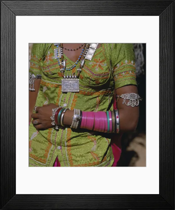 Framed Print : Young woman wearing jewellery around neck and on her arms Framed Print : Young woman wearing jewellery around neck and on her arms