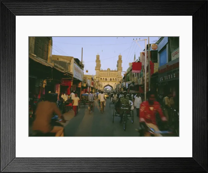 Framed Print : Street scene with bicycles and rickshaw and the Char Minar Framed Print : Street scene with bicycles and rickshaw and the Char Minar