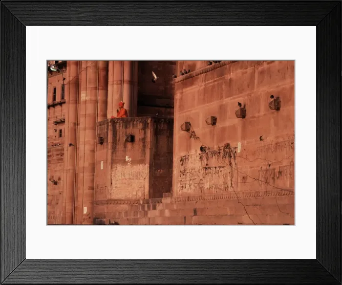 Framed Print : A sanyasin meditates overlooking the Ganges at dawn Framed Print : A sanyasin meditates overlooking the Ganges at dawn