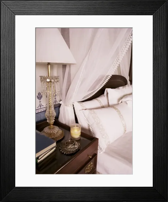 Framed Print : Detail of side table and four poster bed in bedroom Framed Print : Detail of side table and four poster bed in bedroom