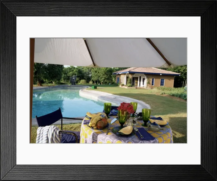 Framed Print : Eco friendly swimming pool and solar panels in background