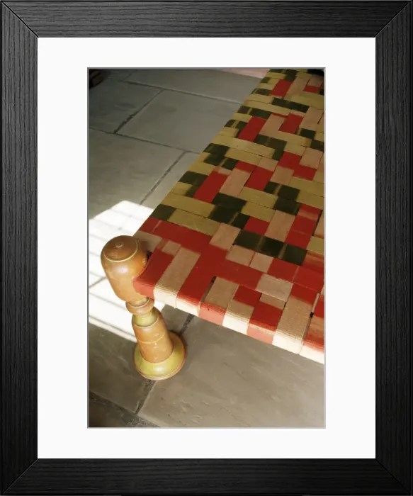 Framed Print : Traditional antique low Indian bed with lacquered bed legs Framed Print : Traditional antique low Indian bed with lacquered bed legs