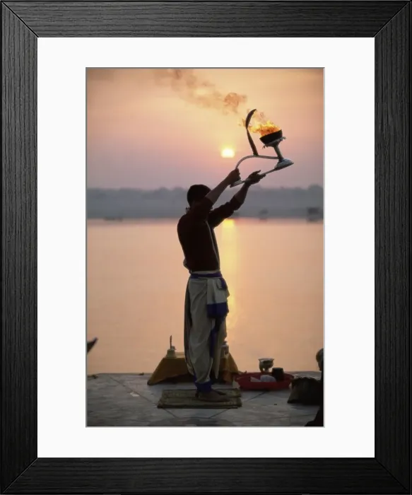 Framed Print : Hindu man worshipping in front of setting sun Framed Print : Hindu man worshipping in front of setting sun