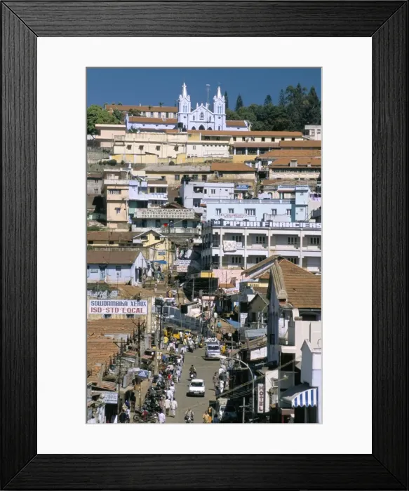Framed Print : Downtown area overlooked by large Christian church Framed Print : Downtown area overlooked by large Christian church