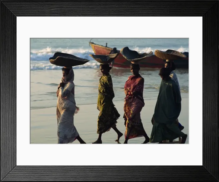 Framed Print : Women using turtle shells to carry fish on their heads