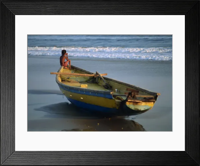 Framed Print : Young boy staring out to sea at dusk Framed Print : Young boy staring out to sea at dusk