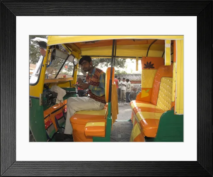 Framed Print : Rickshaw owner sitting in his newly decorated moto rickshaw Framed Print : Rickshaw owner sitting in his newly decorated moto rickshaw