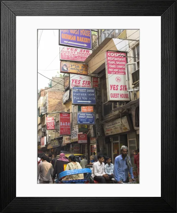 Framed Print : People riding rickshaws and street signs Framed Print : People riding rickshaws and street signs