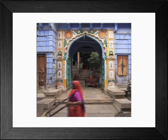 Framed Print : Street sweeper passing open porch of typical old haveli Framed Print : Street sweeper passing open porch of typical old haveli