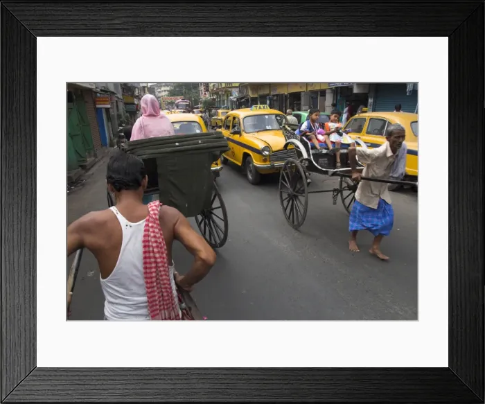 Framed Print : Hand pulled rickshaws and yellow taxis Framed Print : Hand pulled rickshaws and yellow taxis