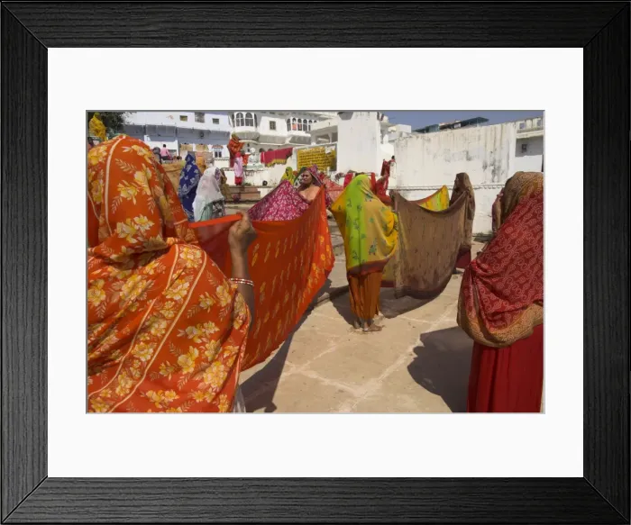 Framed Print : Group of women drying their saris by the sacred lake Framed Print : Group of women drying their saris by the sacred lake