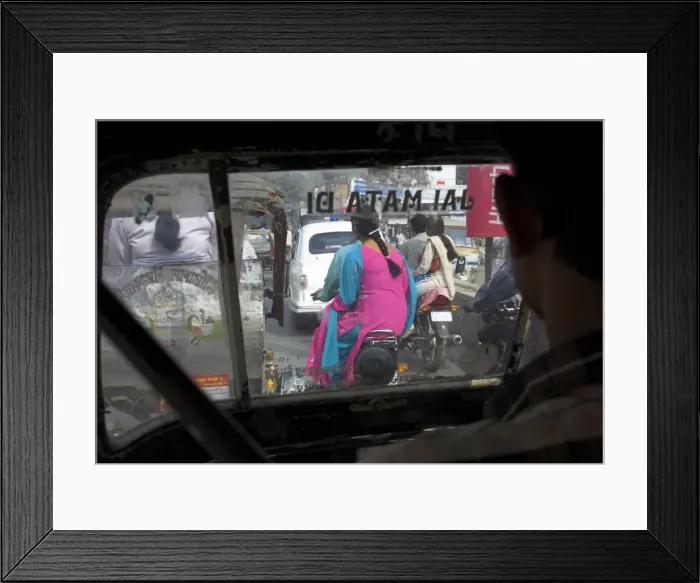 Framed Print : Women riding on back of motorcycles in heavy traffic Framed Print : Women riding on back of motorcycles in heavy traffic