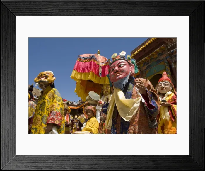 Framed Print : Group of monks in wooden masks and traditional costumes Framed Print : Group of monks in wooden masks and traditional costumes