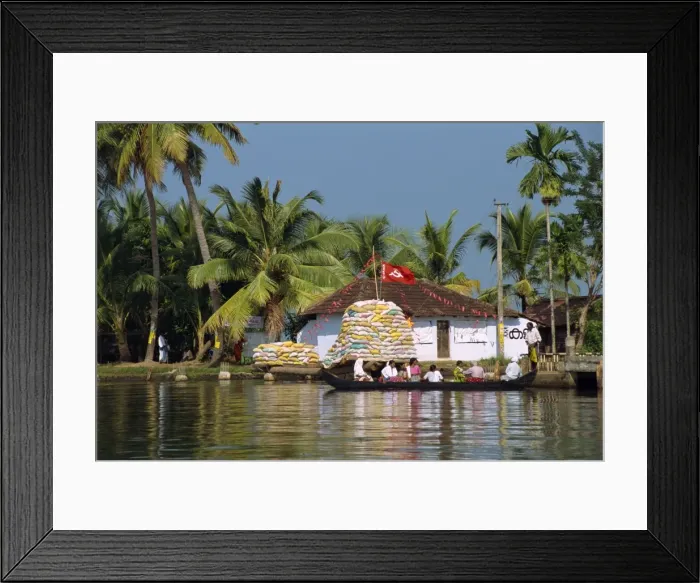 Framed Print : Small boat passing Communist flag Framed Print : Small boat passing Communist flag