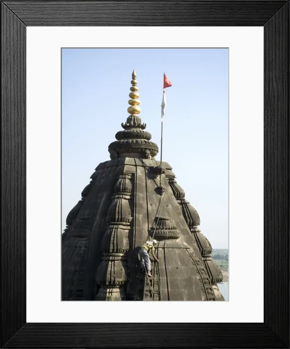 Framed Print : Man picking weeds out of the Shiva Hindu temple on Framed Print : Man picking weeds out of the Shiva Hindu temple on