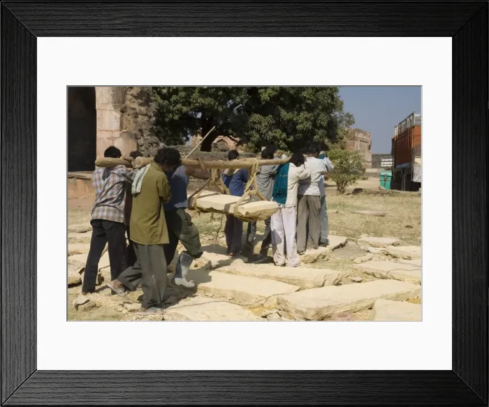Framed Print : Lifting by hand heavy stones for restoration work