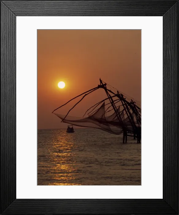 Framed Print : Fishing nets at sunset
