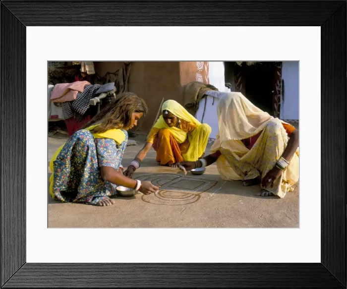 Framed Print : Women painting a mandana on the ground Framed Print : Women painting a mandana on the ground