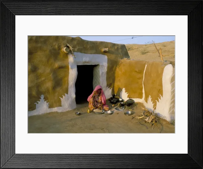 Framed Print : Woman cooking outside house with painted walls Framed Print : Woman cooking outside house with painted walls