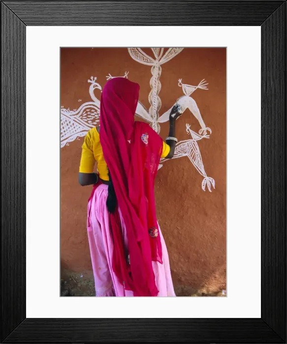 Framed Print : Woman decorating her house with traditional local designs Framed Print : Woman decorating her house with traditional local designs