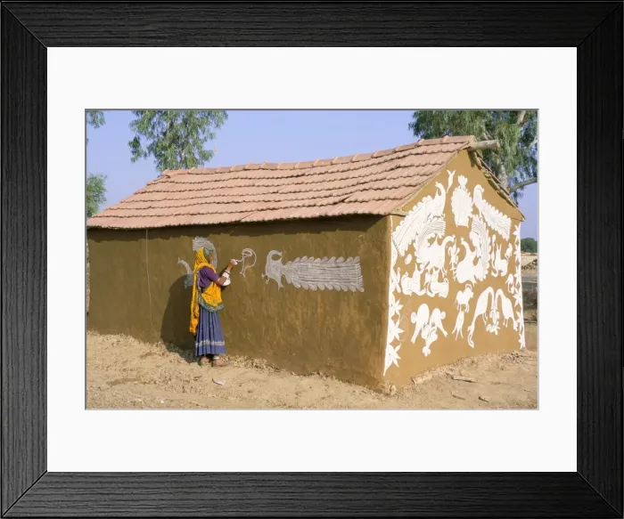Framed Print : Woman painting walls of a house in a village near Jodhpur Framed Print : Woman painting walls of a house in a village near Jodhpur