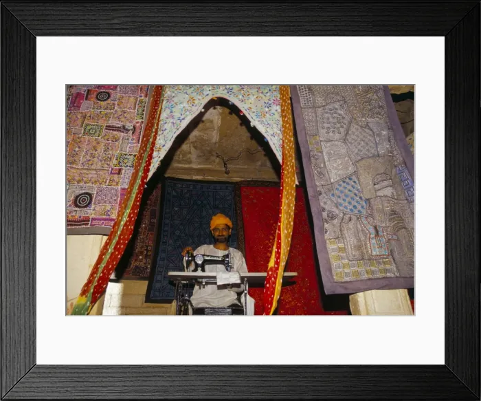 Framed Print : Textile worker at his sewing machine Framed Print : Textile worker at his sewing machine