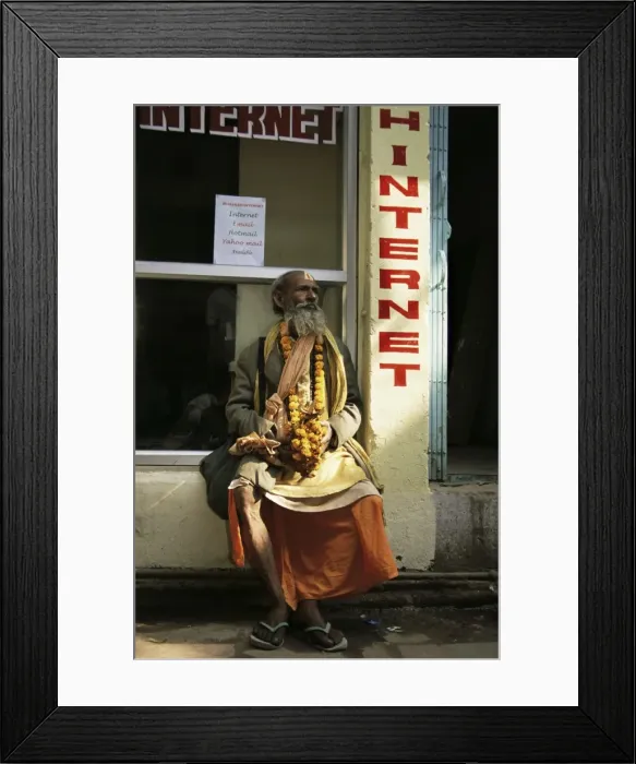 Framed Print : Sadhu (Hindu holy man) sitting outside an internet cafe Framed Print : Sadhu (Hindu holy man) sitting outside an internet cafe