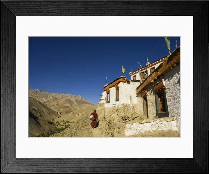 Framed Print : Monk walking past Lamayuru gompa (monastery) Framed Print : Monk walking past Lamayuru gompa (monastery)