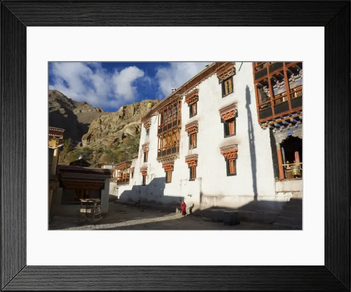 Framed Print : Buddhist monk walking past Hemis gompa (monastery) Framed Print : Buddhist monk walking past Hemis gompa (monastery)