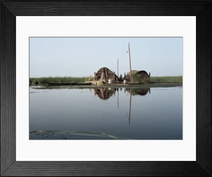 Framed Print : Reed houses and boat Framed Print : Reed houses and boat