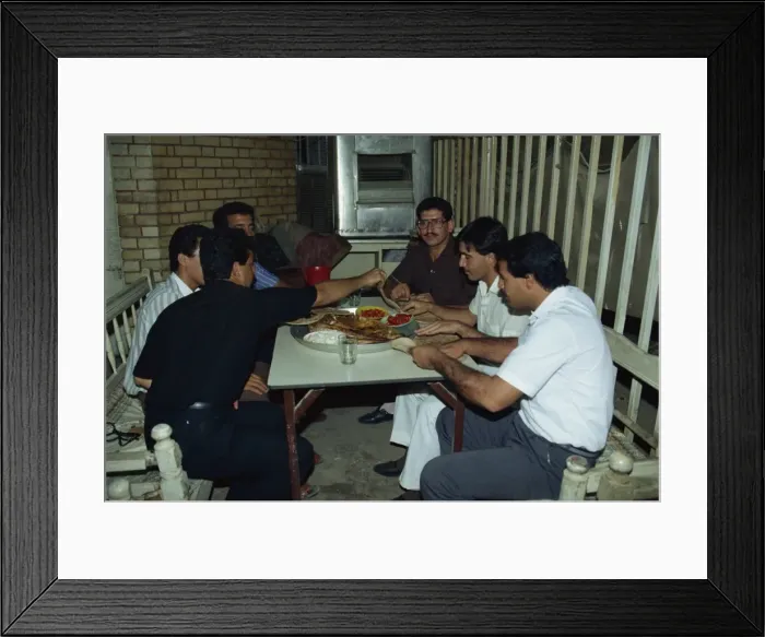 Framed Print : Portrait of a group of men friends enjoying meal of Mazgouf Framed Print : Portrait of a group of men friends enjoying meal of Mazgouf