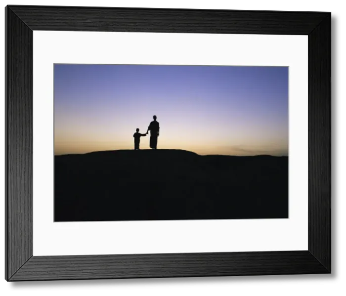 Framed Print : Silhouette of two people at the archaeological area Framed Print : Silhouette of two people at the archaeological area