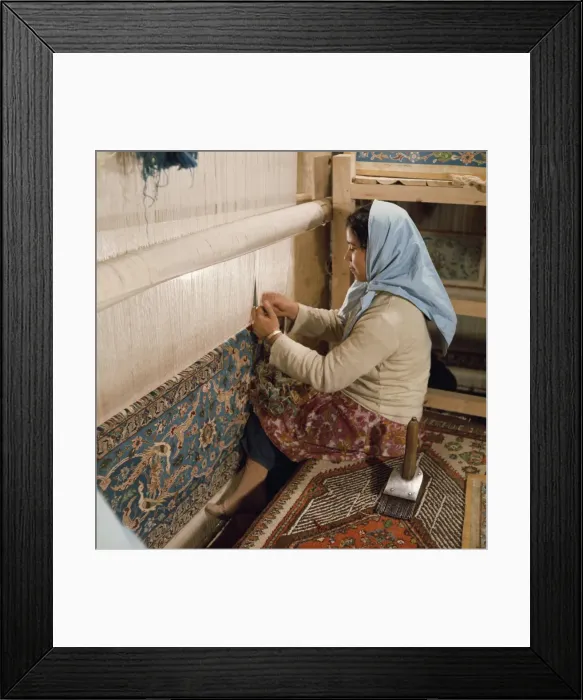 Framed Print : Young woman weaving carpet on loom Framed Print : Young woman weaving carpet on loom