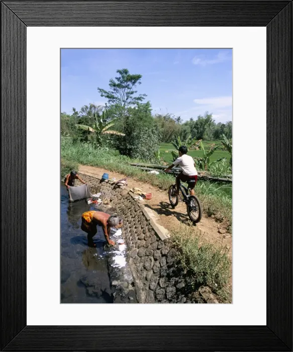 Framed Print : Ladies washing in canal near Candi Suimberawan Framed Print : Ladies washing in canal near Candi Suimberawan