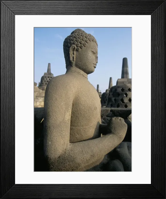 Framed Print : Side view of Buddha image sitting in open chamber with Framed Print : Side view of Buddha image sitting in open chamber with